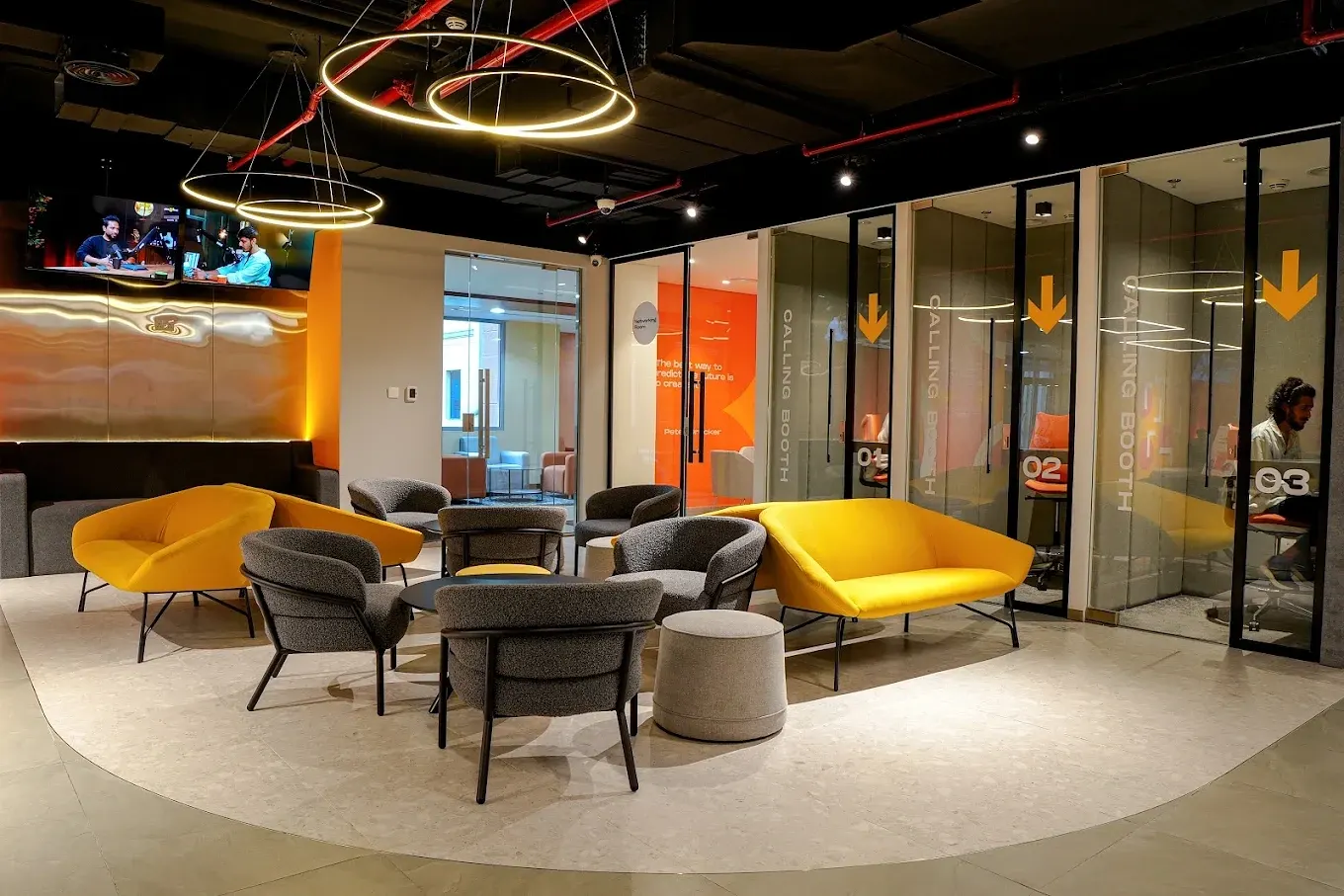Networking lounge seating with three calling booths in use
